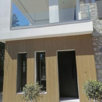 Exterior cladding with Aris 3d oak panels system. Project May 2022.